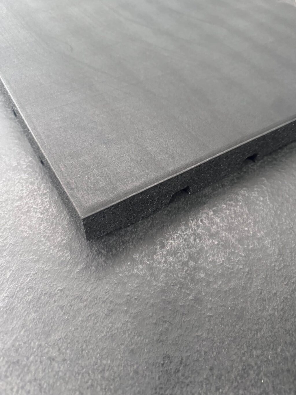 Corner of rubber gym tile flooring underside 500mm x 500mm
