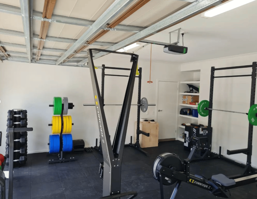 home gym equipment setup in a garage