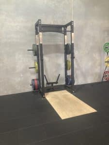 Power rack with bamboo platform and coloured weight plates Melbourne